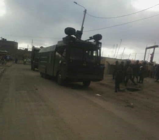 A police water canon placed strategically at Jacaranda