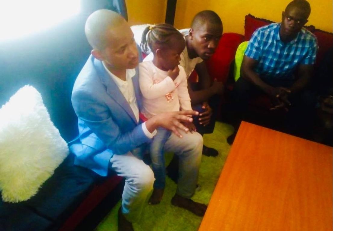 Babu Owino with the late OCS Ragira Samwel's daughter Talia when he visited his home